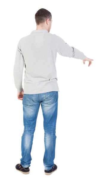 Back view of  pointing young men - Foto, Bild