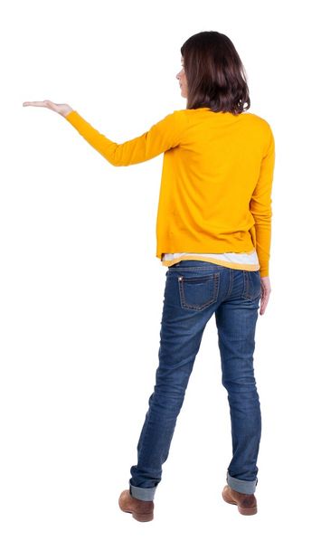 Back view of Beautiful business woman in yellow pulover looking - 写真・画像