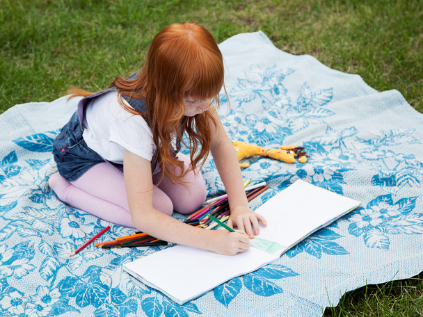 Little redhead girl drawing - Photo, Image