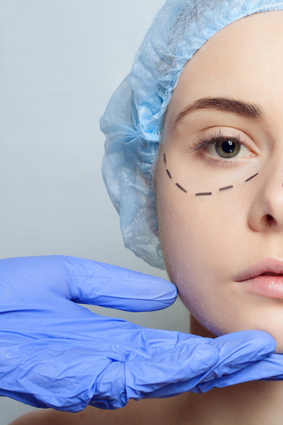 Beautiful young woman perforation lines plastic surgery operatio - 写真・画像