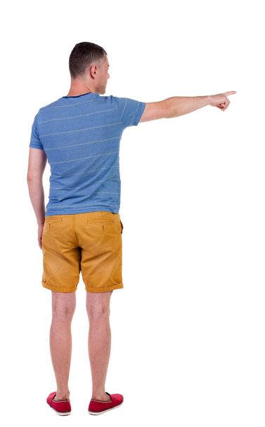 Back view of  pointing young men in  shorts. - Fotoğraf, Görsel