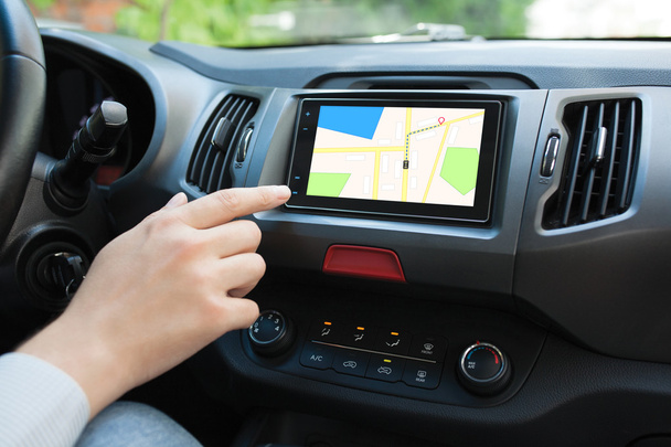 Man touching to screen multimedia system with navigation map  - Foto, Imagem