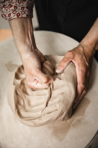 Unrecognizable potter master mashing the clay - Φωτογραφία, εικόνα
