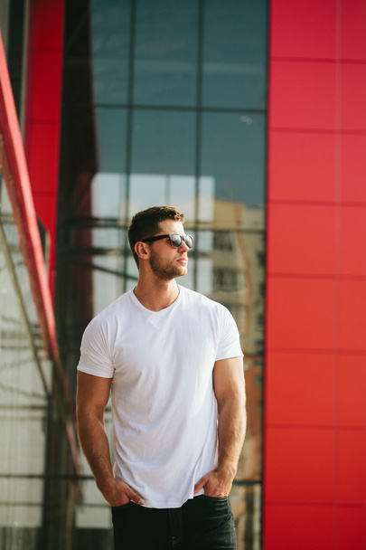 Hipster wearing white blank t-shirt with space for your logo - Photo, Image