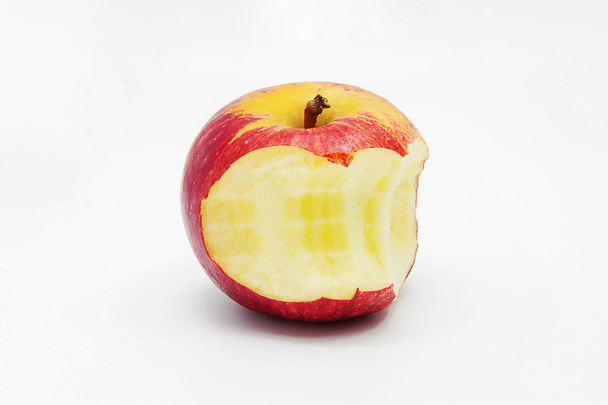 Red bitten apple with shadow. - Foto, Imagem