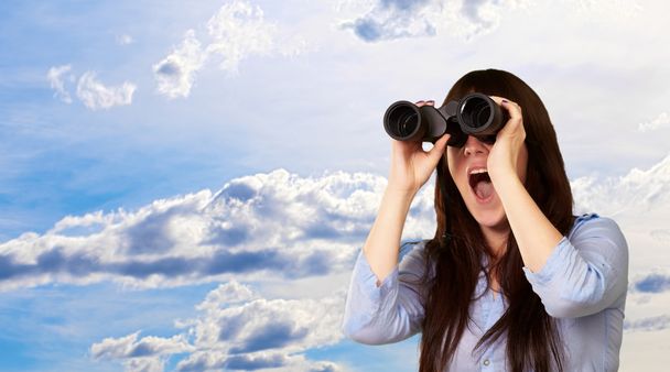 Portrait Of A Young Woman Looking Through Binoculars - Photo, Image