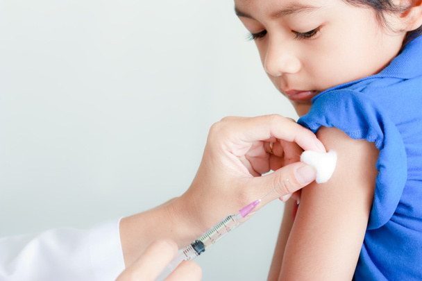 Boy and vaccine syringe - Foto, imagen