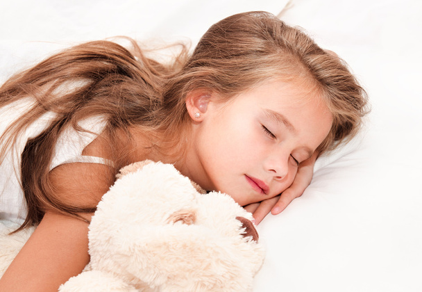 Adorable little girl sleeping with toy  - 写真・画像