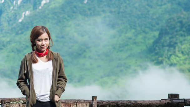Smiling young woman With  Montains Background - Photo, Image