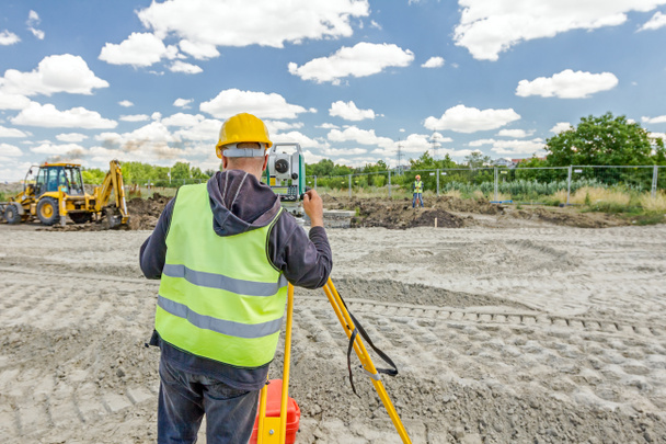 Geodesist is working with total station on a building site. Civi - Photo, Image