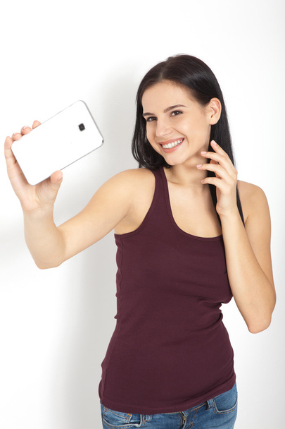 Attractive woman making selfie photo on smartphone isolated - Foto, Imagem