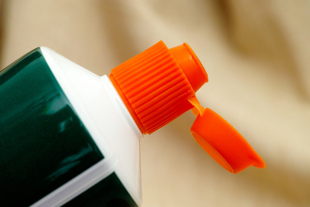Open orange cap of toothpaste tube - Fotoğraf, Görsel