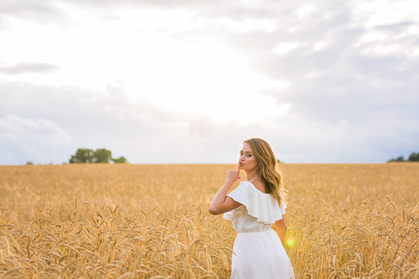 Happy woman in golden wheat - Фото, изображение