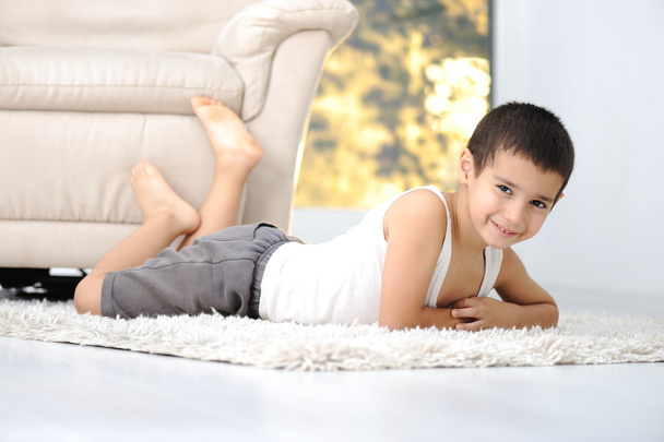 Happy child on floor in living room at home - Фото, зображення