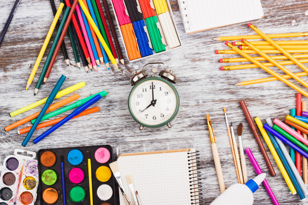 Different school supplies on the wooden background - 写真・画像