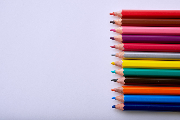 colored pencils on white letter column - Fotografie, Obrázek