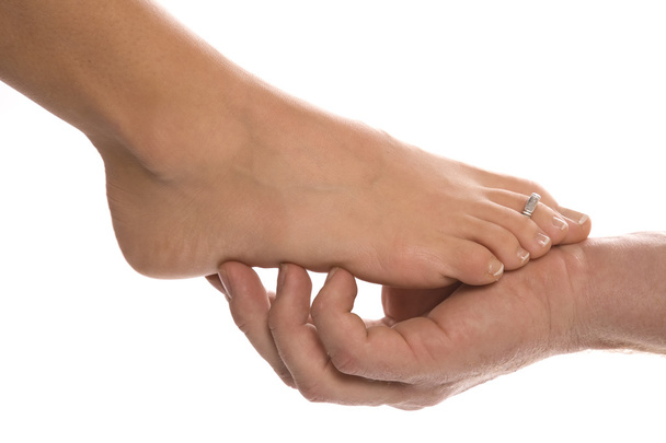 Man holding woman feet - Zdjęcie, obraz