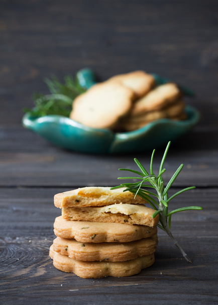 Homemade cookies with rosemary on a wooden surface - Photo, Image