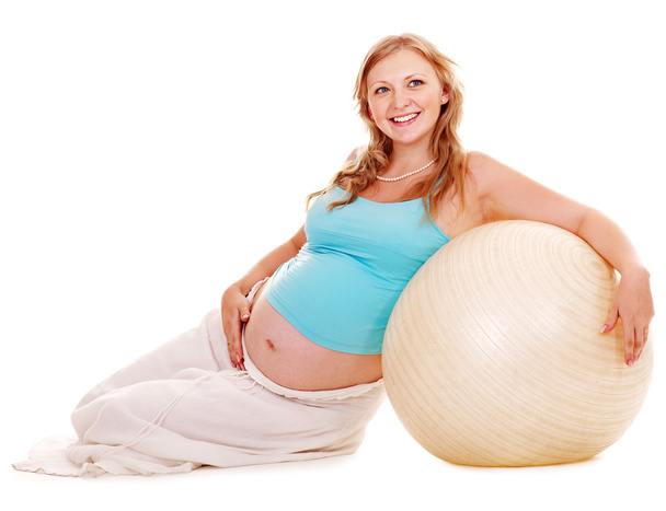 Беременная женщина занимается спортом
. - Фото, изображение