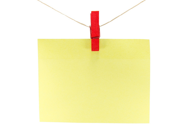 folha de papel amarelo para notas e clipe
 - Foto, Imagem