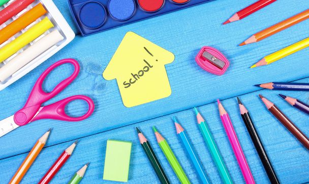 School accessories and shape of building on blue boards, back to school concept - Фото, зображення