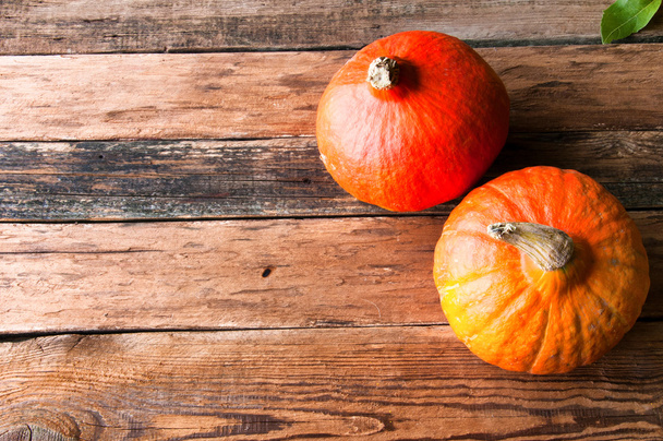 Pumpkins on vintage wooden table. Copyspace. View from above - Foto, imagen