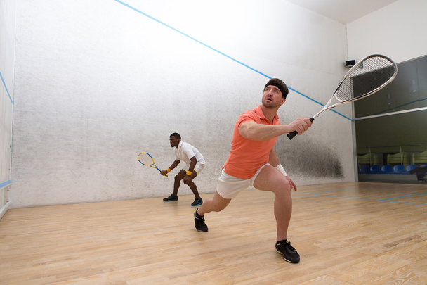 Férfi játszik squash - Fotó, kép