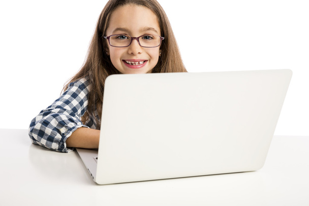 Little girl working with a laptop - Foto, Imagem