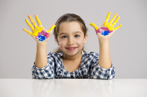 little girl with hands in paint - Фото, изображение