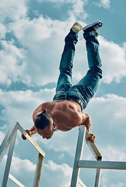 handstand exercise man outdoor - Фото, изображение