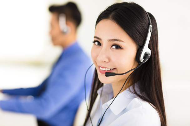 Beautiful call center agent working in office - Photo, Image