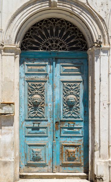 Blue aged Tunisian wooden door  - Фото, зображення