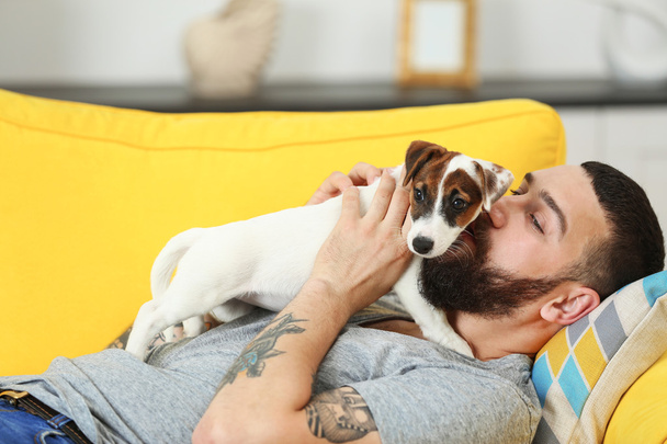 Handsome man with dog - Photo, image