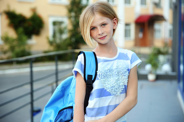 Cute schoolgirl on street - Foto, Imagen