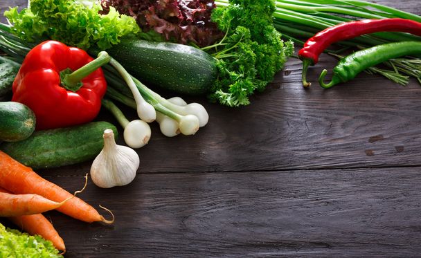 Border of fresh vegetables on wooden background with copy space - Foto, immagini