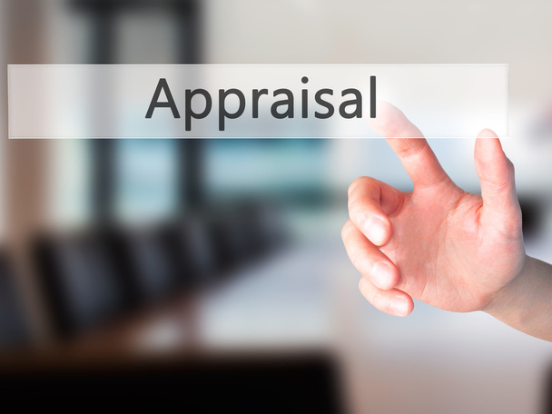 Appraisal - Hand pressing a button on blurred background concept - Photo, Image
