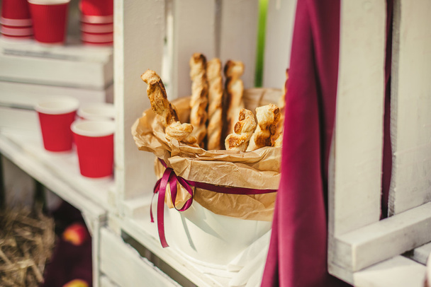 Tasty breadsticks in paper basket - Photo, Image
