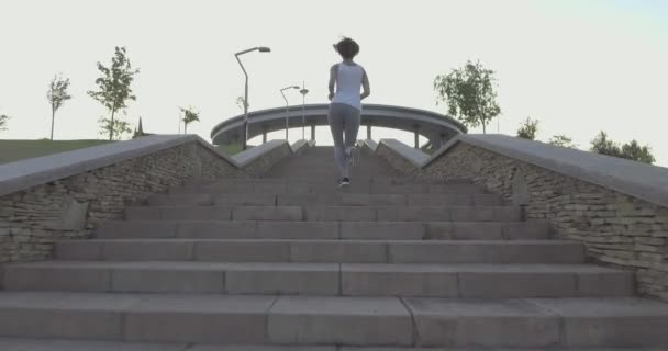 a girl while jogging in park - Footage, Video