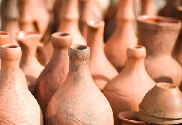 Many handmade old clay pots on the shelf. - Photo, Image