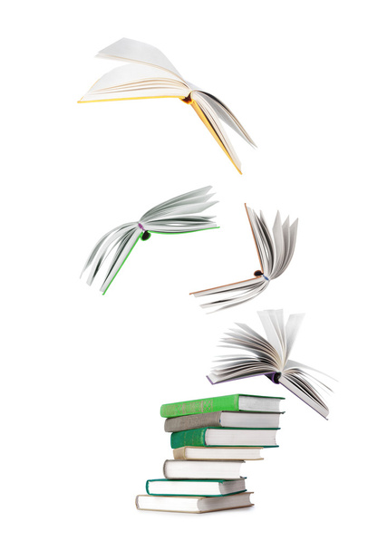 stack of books and flying books isolated on white - Photo, Image