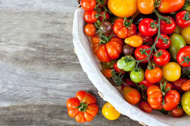 colorful tomatoes in basket - Photo, image