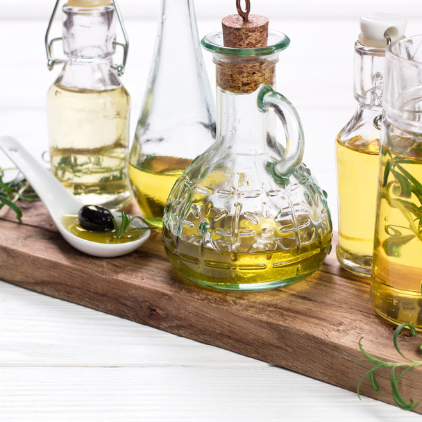 Oils on vintage wooden background . healthy food  - Φωτογραφία, εικόνα