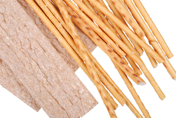 Соленые хлебные палочки, изолированные на белом
 - Фото, изображение
