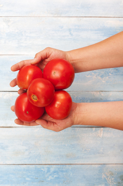 Red organic tomatoes in hands - Fotoğraf, Görsel