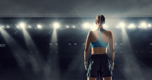 Young boxer woman at ring . Mixed media - Photo, Image