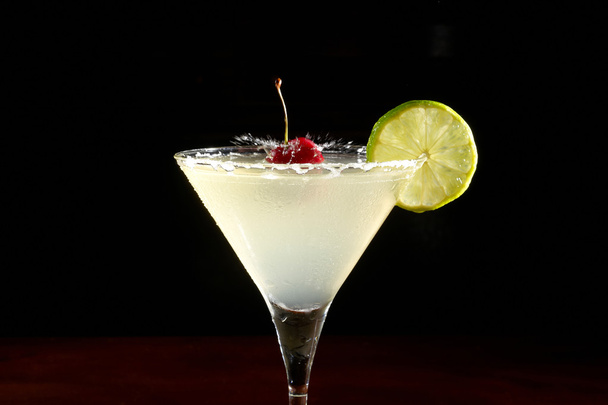 Cocktail with lemon and cherry - Photo, Image