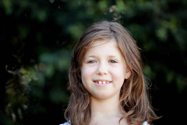 Pretty eight year old girl in the park - Photo, Image