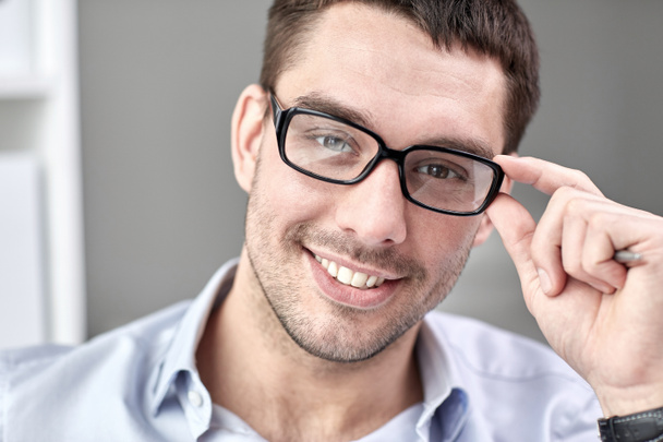 portrait of businessman in eyeglasses at office - Photo, Image