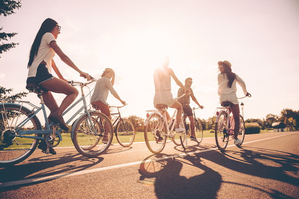  young people riding bicycles  - 写真・画像