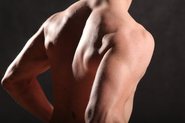 nude male torso and muscle on black background - Valokuva, kuva